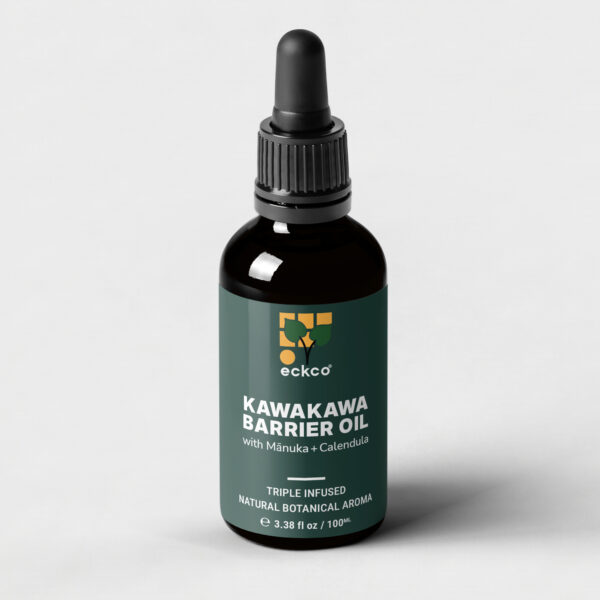 A dark brown glass dropper bottle of eckco brand Kawakawa Barrier Oil. The dark green label features a stylized tree logo and the text 'KAWAKAWA BARRIER OIL with Mānuka + Calendula'. Below a horizontal line, it says 'TRIPLE INFUSED NATURAL BOTANICAL AROMA' and 'e 3.38 fl oz / 100ML' at the bottom. The bottle is set against a plain light grey background
