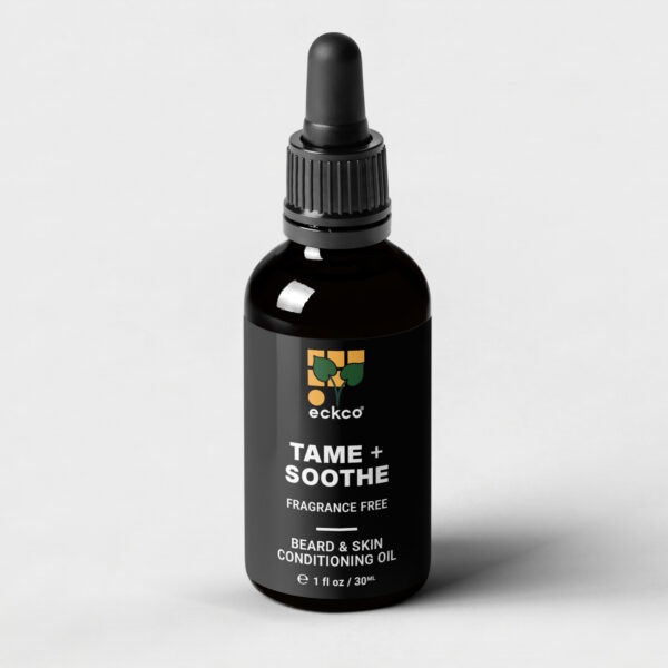 A 30ml dark glass dropper bottle of eckco Tame + Soothe Fragrance Free Beard & Skin Conditioning Oil. The black label features the brand's logo